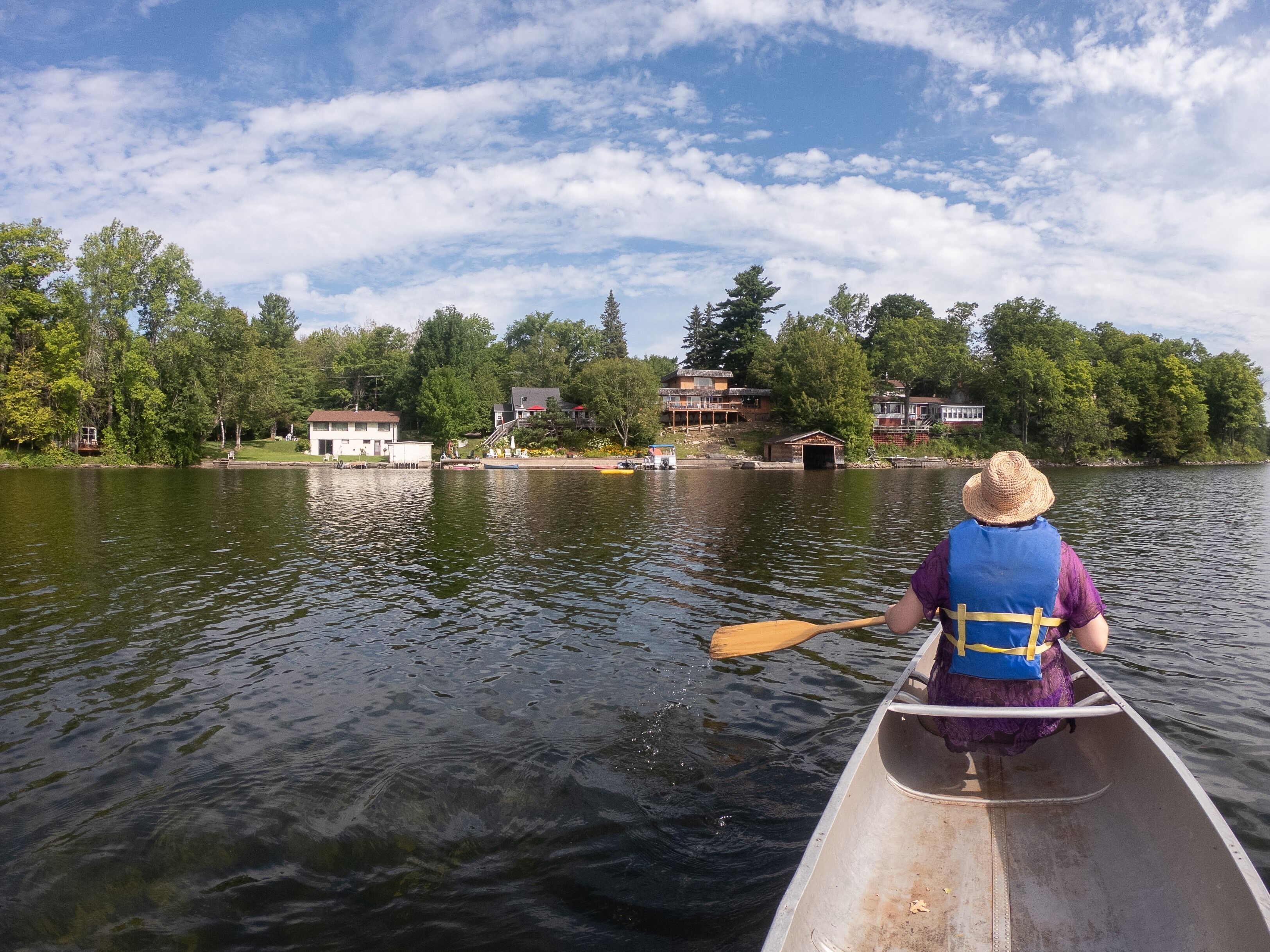 Canoeing on Christie Lake, Perth Canada. Seven miles of water and stunning scenery to enjoy the sun and relax!