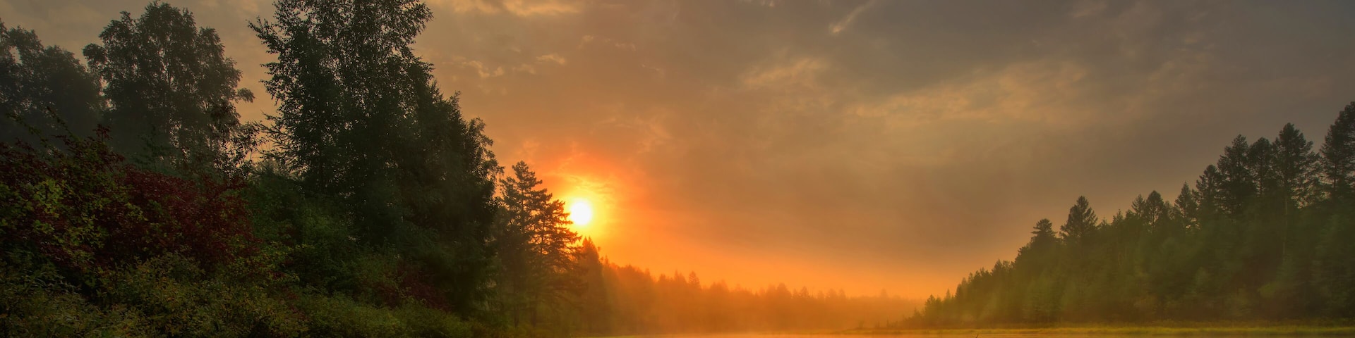 Green Canoe and Chairs on a Dock Next to a Lake at Sunset - Haliburton Highlands, Ontario, Canada