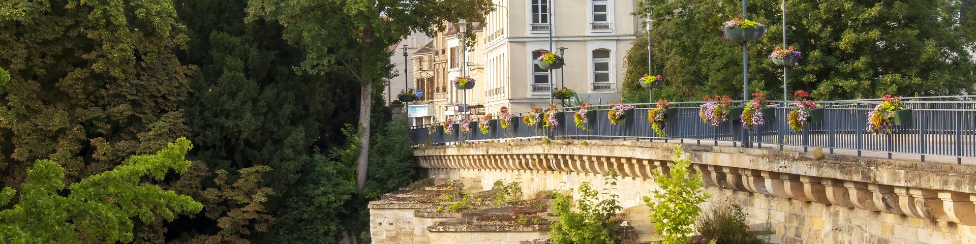 Meulan-en-Yvelines, France - Saturday 30th July 2022: Stone bridge over the river seine at Meulan-en-Yvelines