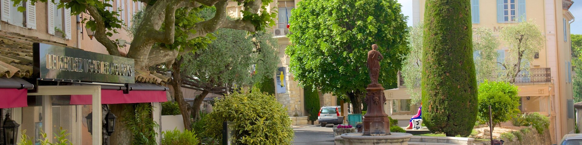 Mougins which includes a small town or village