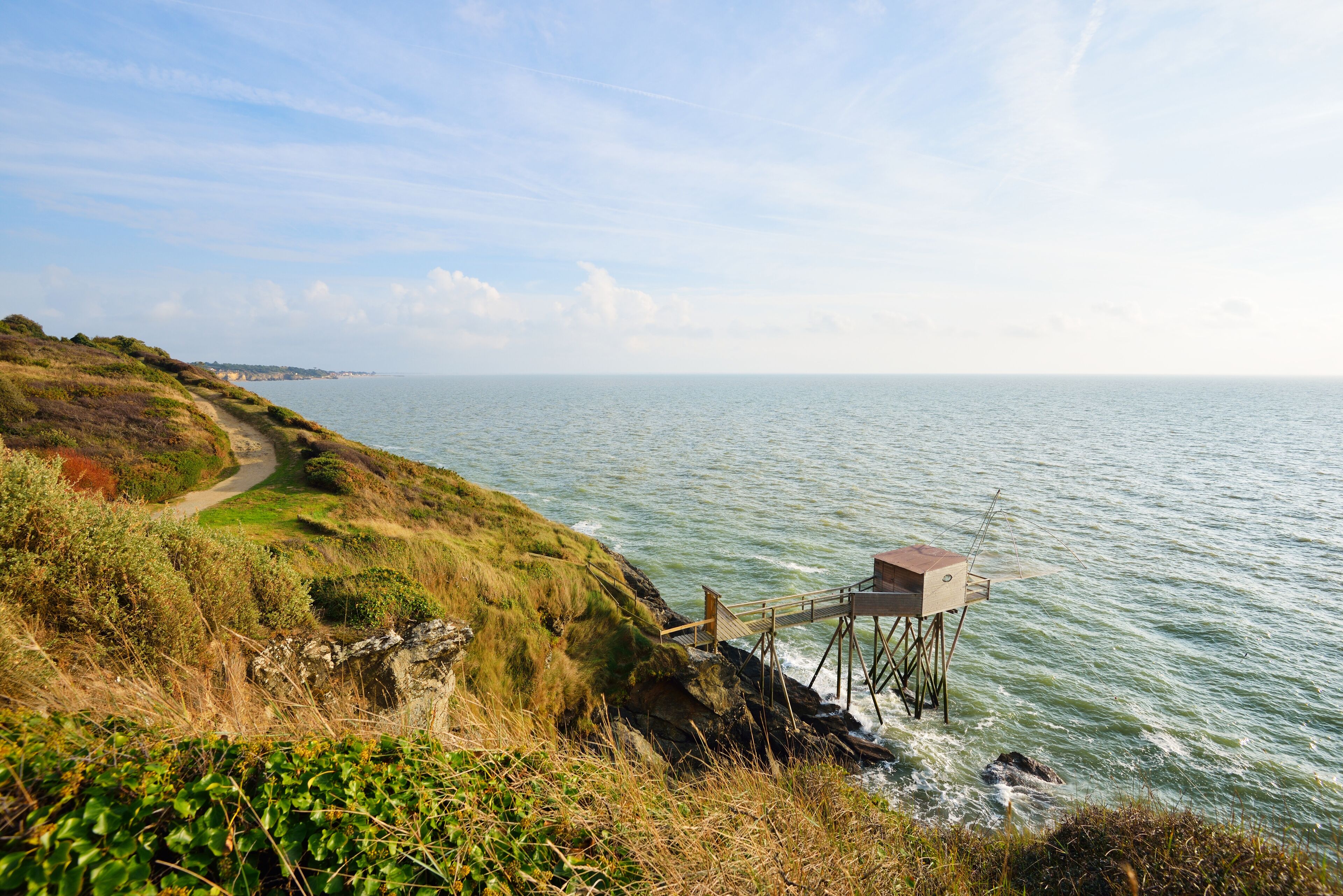 Large fishing net and a beautiful road in grassy dunes. Ocean landscape in Pornic, France., Shutterstock ID 419394256, Purchase Order: -