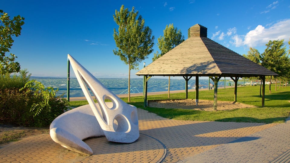 A sculpture, a gazebo, and a view of the sea.