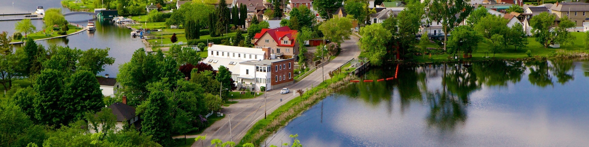 Westport featuring a river or creek, a lake or waterhole and a small town or village
