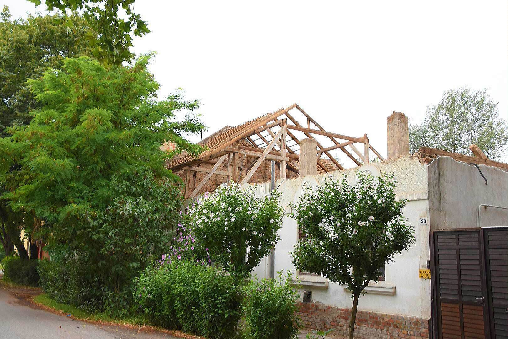 Old house being demolished brick by brick before the developer can start building its fleshy nephew.