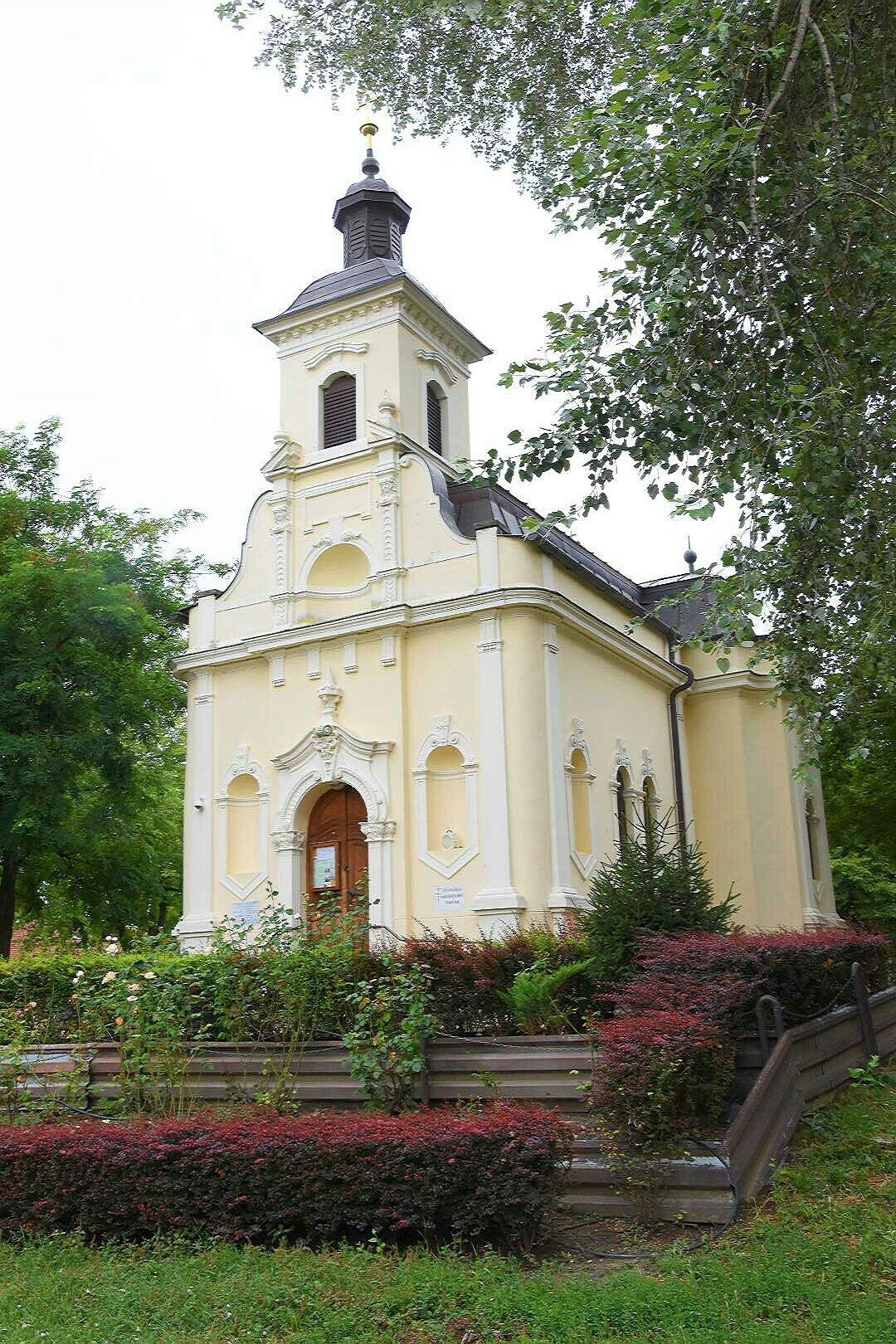 St. Rosalie Greek Catholic chapel, built in 1881. 
It's a tiny church originated as votive church after a pest epidemic. The square that houses it is lush with vegetation.