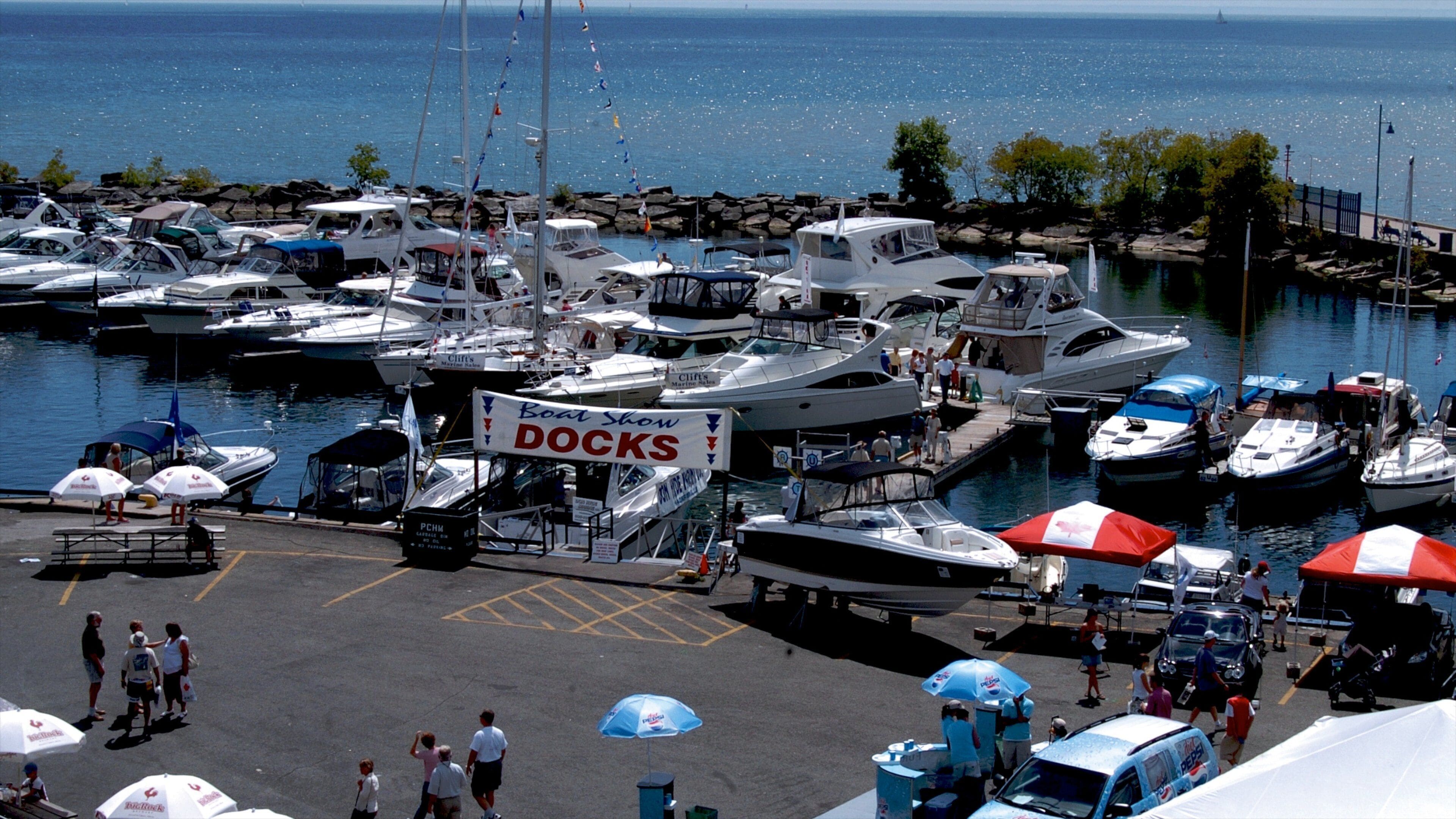 Port Credit showing signage, general coastal views and a marina