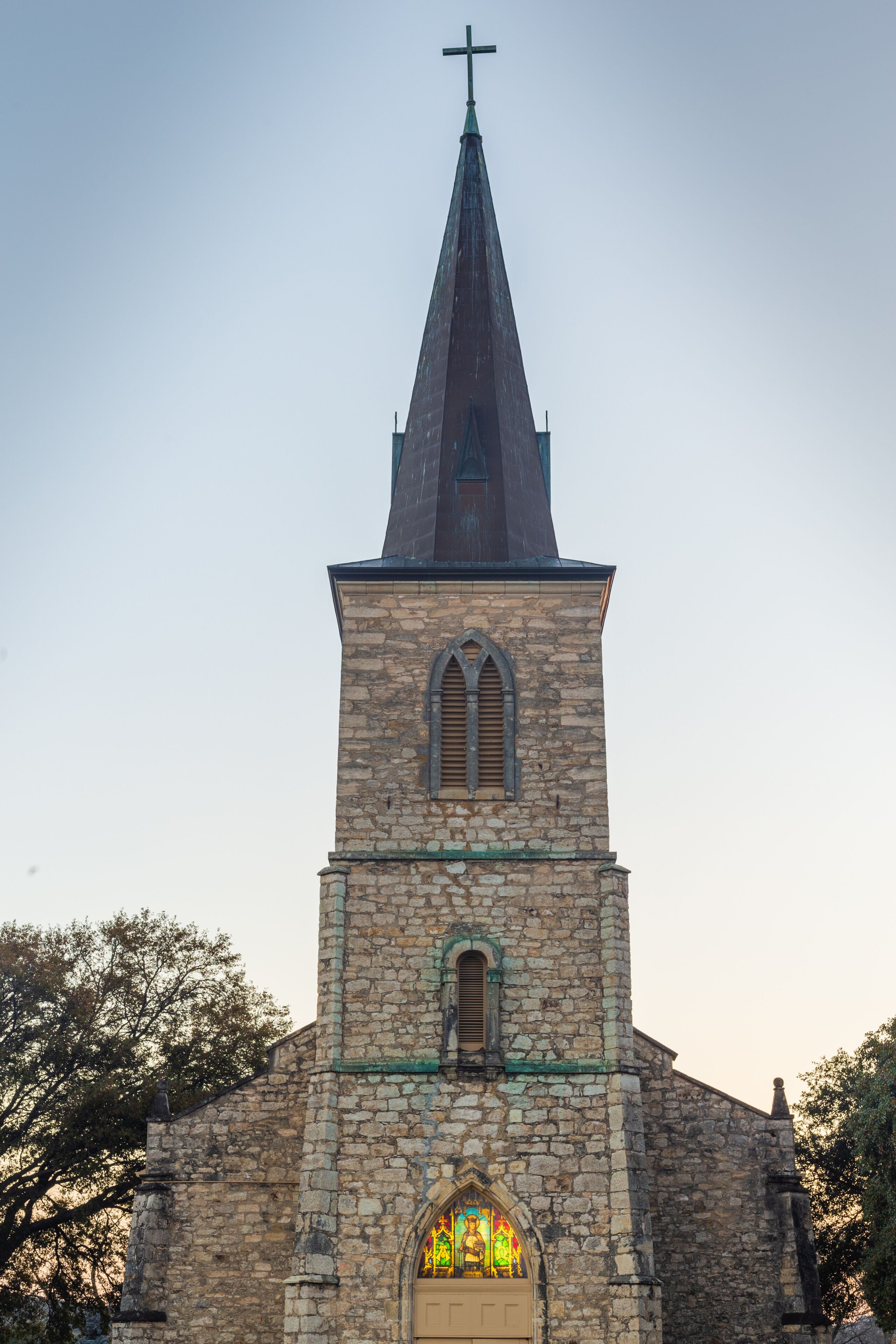 Sun shining through stained glass at St. Louis Catholic Church in Castroville was built in 1867 with local limestone. The Parish was established in 1844 with the earliest settlement of the town.