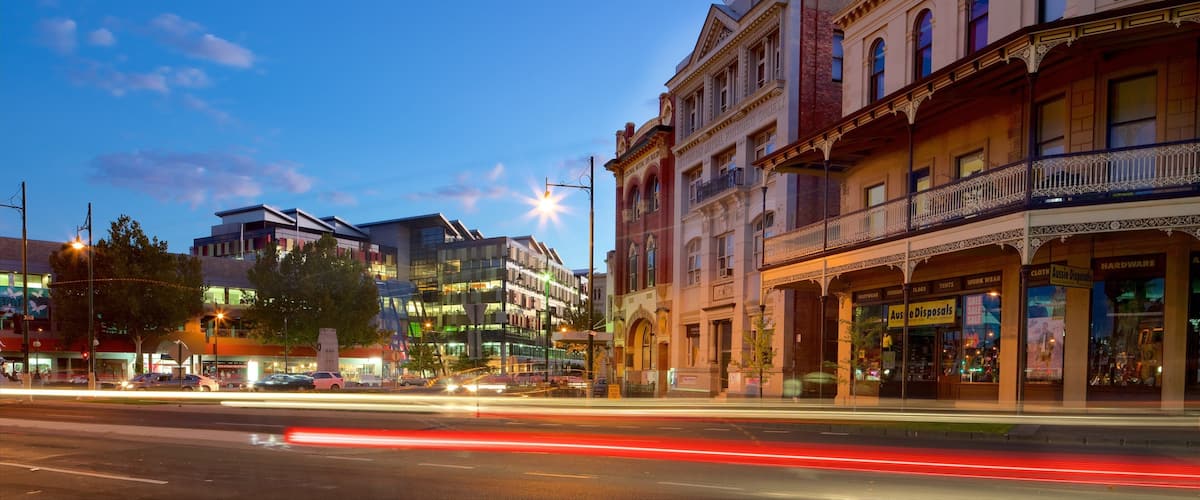 A street with historic buildings and modern architecture.