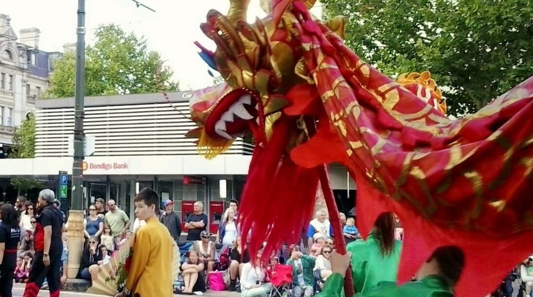Bendigo Easter Sunday Parade (2013). The Easter street parade seems go on enjoyably forever and features as a climax the world's longest imperial dragon. It takes over 100 people to operate it. This picture show one of many smaller dragons interspersed through the parade.