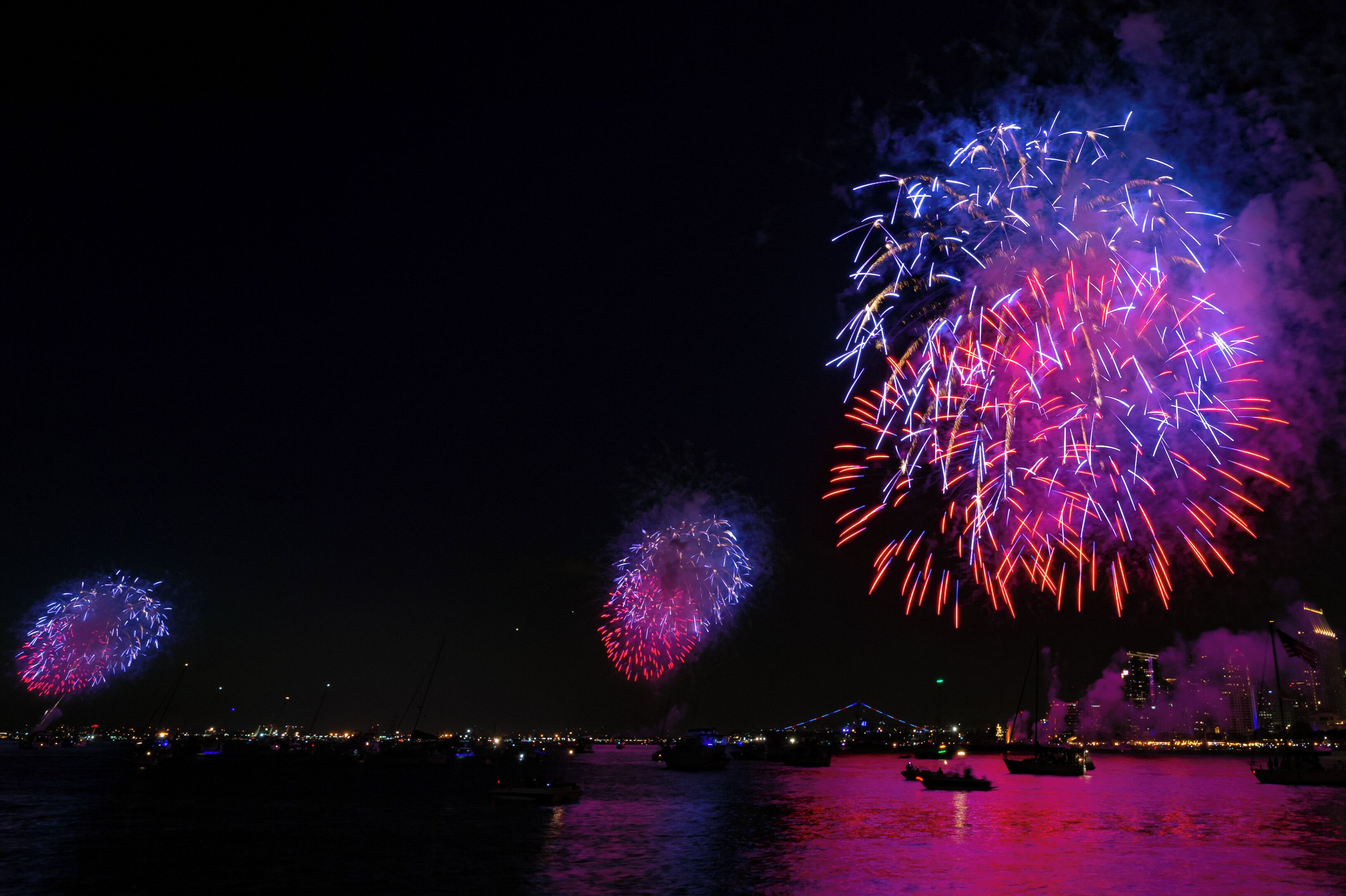 San Diego Port Authority's "Big Bay Boom" synchronizes 4th of July fireworks erupting from 5 locations in San Diego Bay at the same time creating dramatic reflections in the San Diego Bay.  Three of the five sets of fireworks are visible from Coronado.