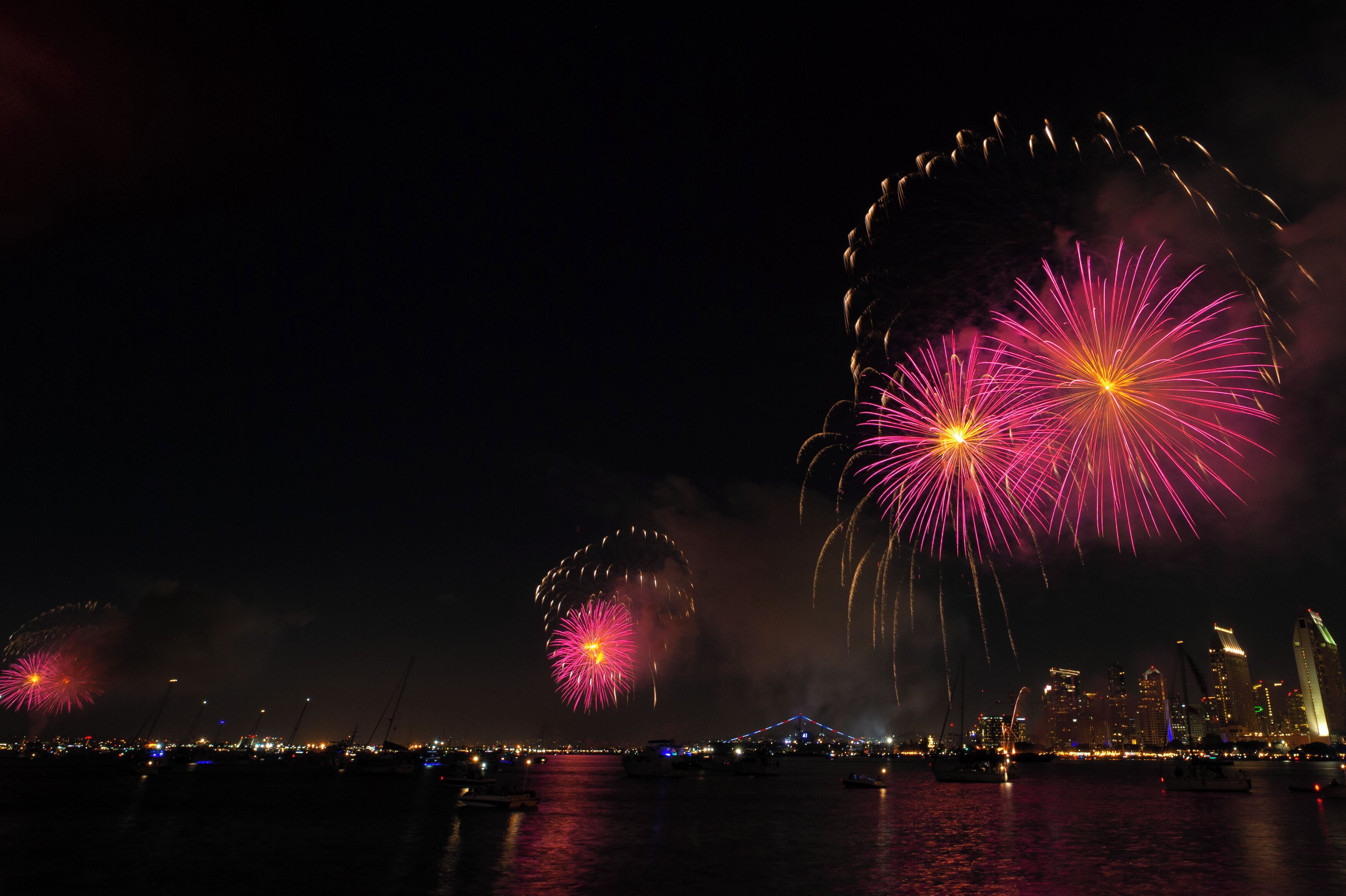 San Diego Port Authority's "Big Bay Boom" synchronizes 4th of July fireworks erupting from 5 locations in San Diego Bay at the same time creating dramatic reflections in the San Diego Bay.  Three of the five sets of fireworks are visible from Coronado.