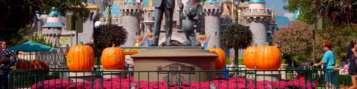 Disneyland® Park which includes rides, flowers and a statue or sculpture