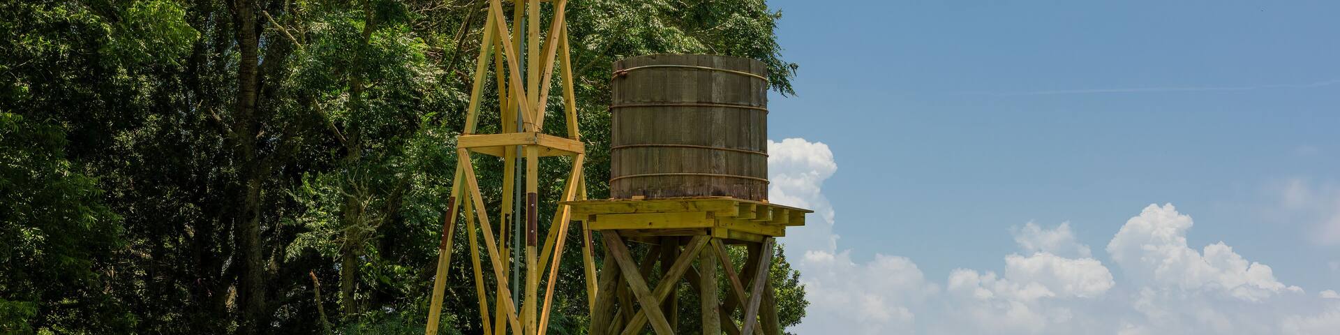 Agricultural landscape with windmill and Cistern at Armand Bayou Nature Park in Pasadena, Texas, USA