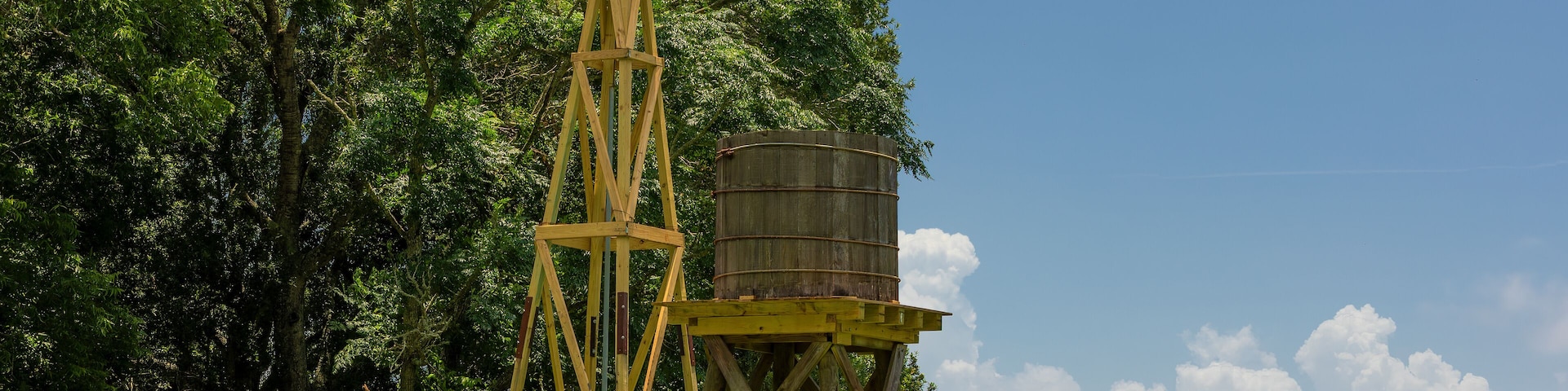 Agricultural landscape with windmill and Cistern at Armand Bayou Nature Park in Pasadena, Texas, USA