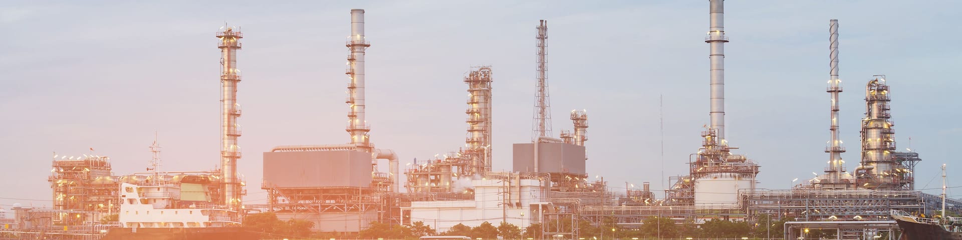 Oil refinery river front, industrial petroleum background