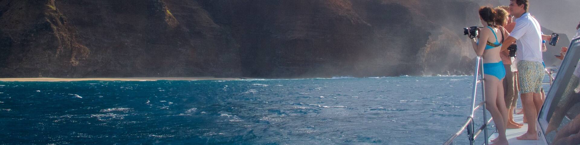 Hanalei which includes general coastal views and a gorge or canyon as well as a small group of people