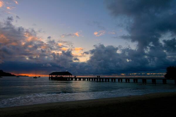 I read that the pier at Hanalei Bay was an ideal spot to take a sunset picture. On the last afternoon on Kauai, my wife and I finished some shaved ice in town and headed to the pier to catch a photo at the end of the sunset. A photographer, and bride and groom are the shadowed persons on the pier.
#BeachTips
#BVSBlue Photo Contest