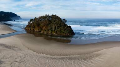 The iconic Proposal Rock stands on the scenic coast of central Oregon in Tillamook County. This part of the Pacific Northwest shoreline is absolutely beautiful and is just off highway 101.