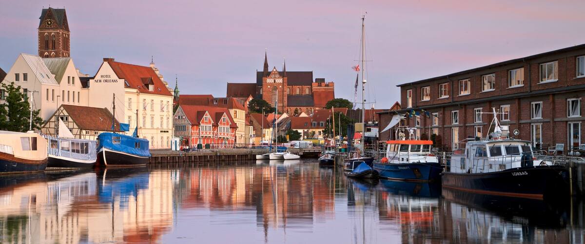 Wismar showing a bay or harbor and a sunset