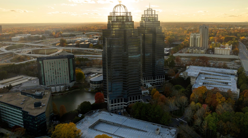 Aerial view of commercial buildings in Atlanta Metro Area with sun rays during sunset
