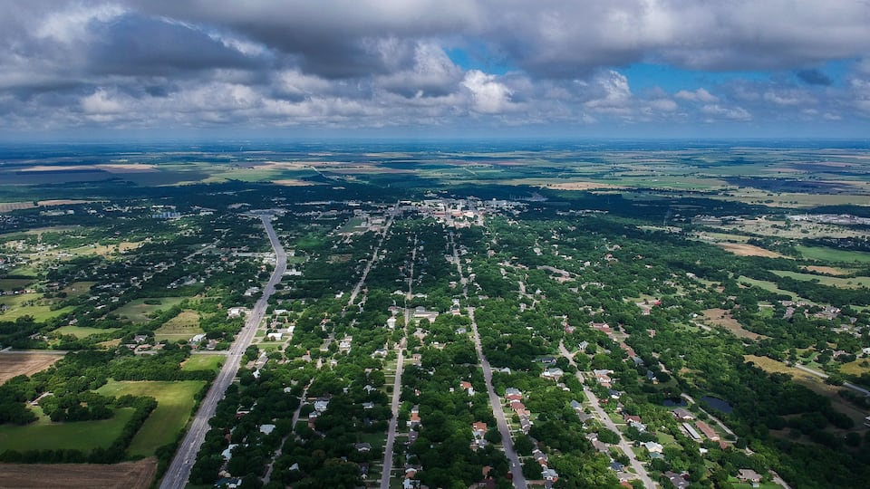 Small Town Hillsboro Texas Aerial shot with Clouds