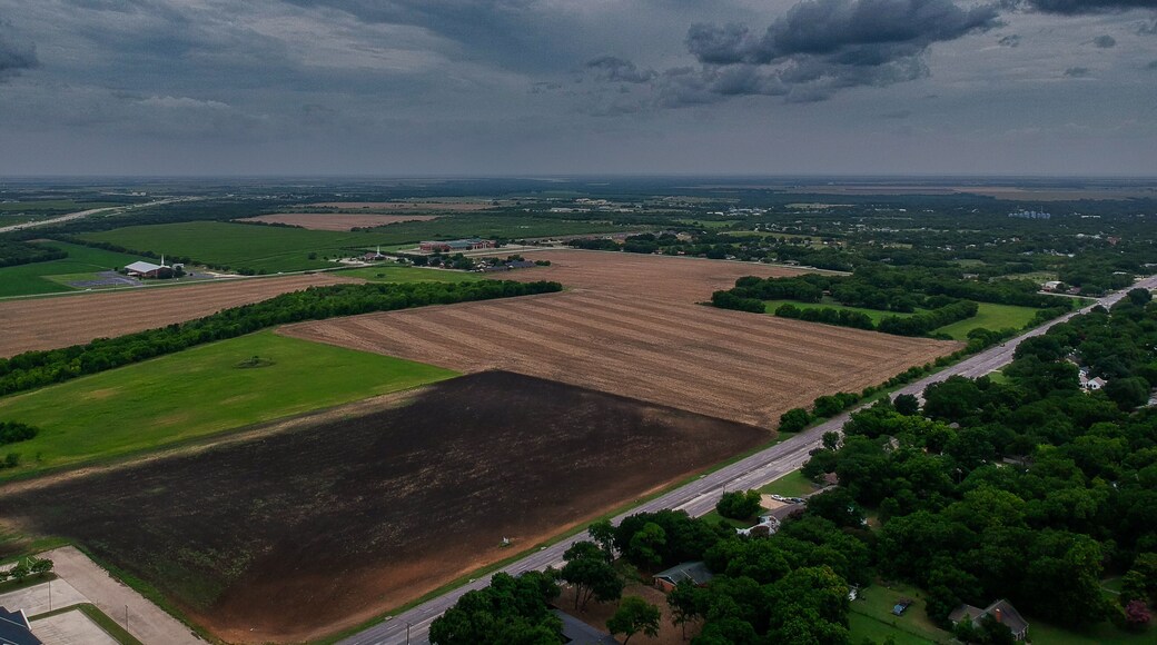 Moody Cloudy Sky over small town Hillsboro Texas Farm Fields
