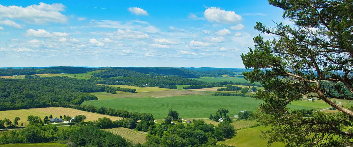 Sunny Summer day landscape of the view from atop Gibraltar Rock of surrounding forests and farmland near Lodi, Wisconsin.