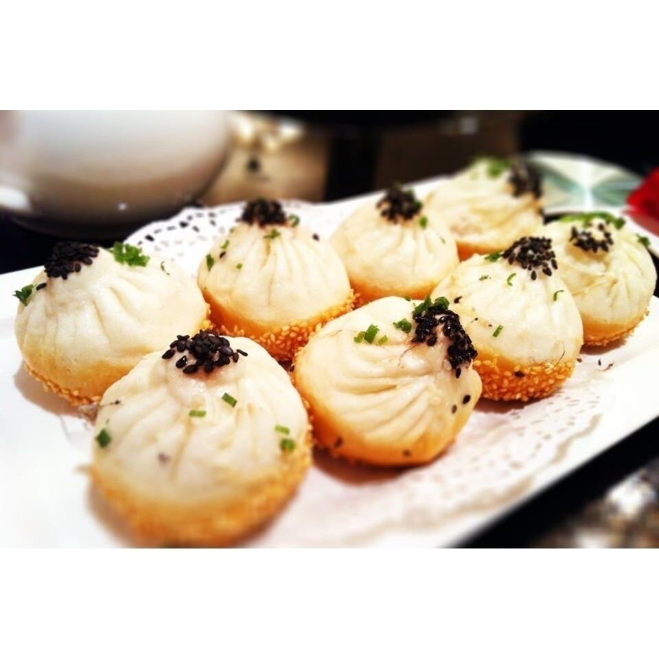 Shanghai pan fried buns. You have to be careful when you bite into them. It has a hot soup inside. 