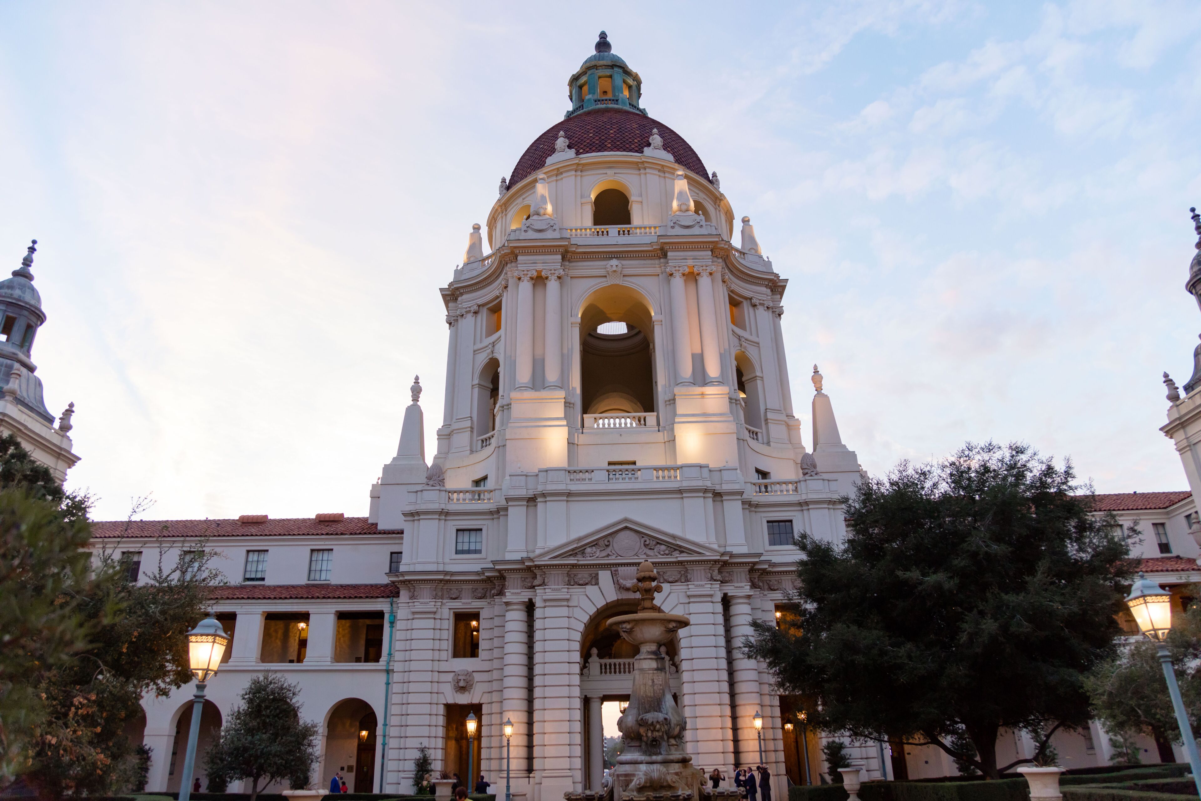 A grand historical building with a prominent dome and arched windows.