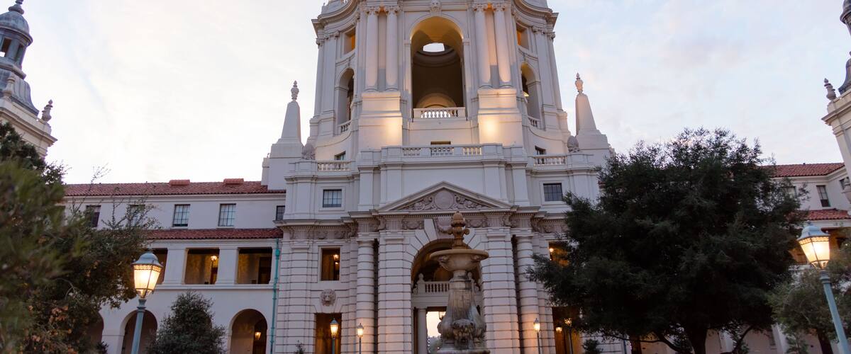 A grand historical building with a prominent dome and arched windows.