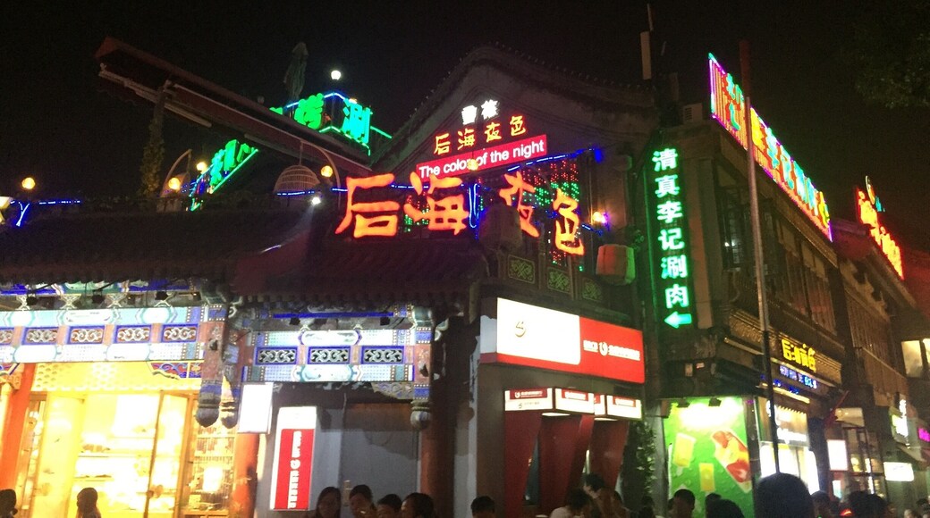 Neon lights by the river in Beijing. A great spot for rooftop bars and people watching! #colorful