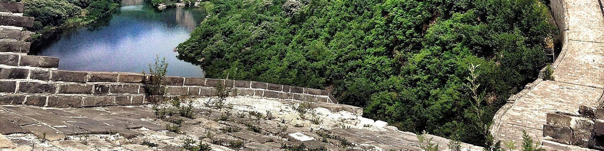 Contrary to the common thought the Great Wall of China is not one long wall, but a series of fortifications with gaps in between.
This picture was taken at the Huanghuacheng part, where the wall crosses a lake and is only in parts restored.
If you want to enjoy this monument to its full extent without being bothered by Showmen and merchants, get yourself a driver/guide and ask him to drive you to a quiet part of the wall. Huanghuacheng and Jinshanling are perfect spots to enjoy the impressive monument!
#china #beijing #greatwall #architecture