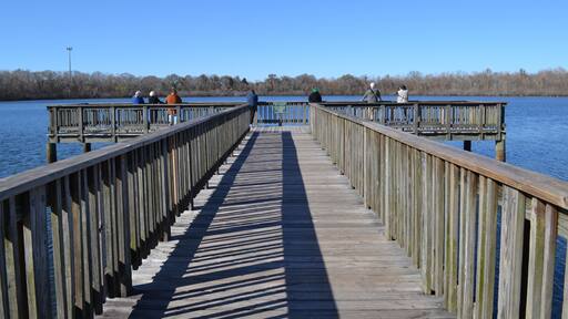 People on the fishing pier, White Lake, Cullinan Park Conservatory, Sugar Land, Texas