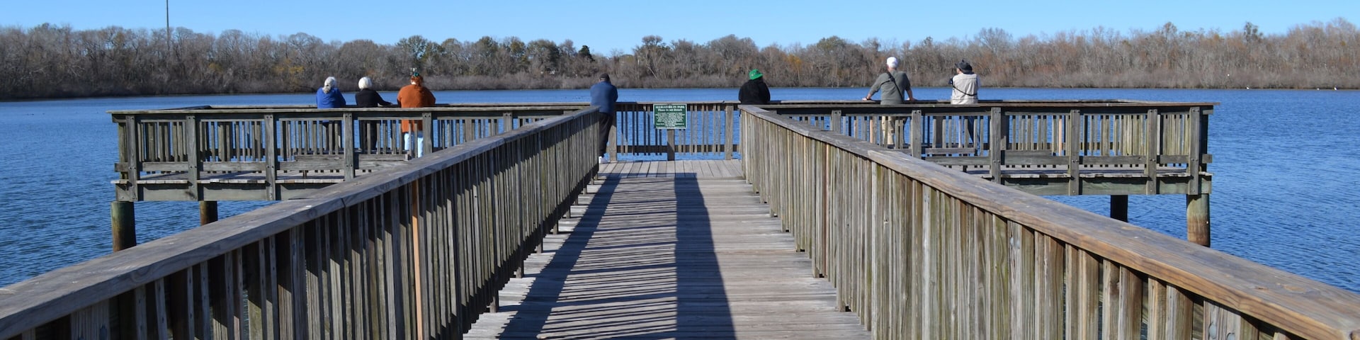 People on the fishing pier, White Lake, Cullinan Park Conservatory, Sugar Land, Texas