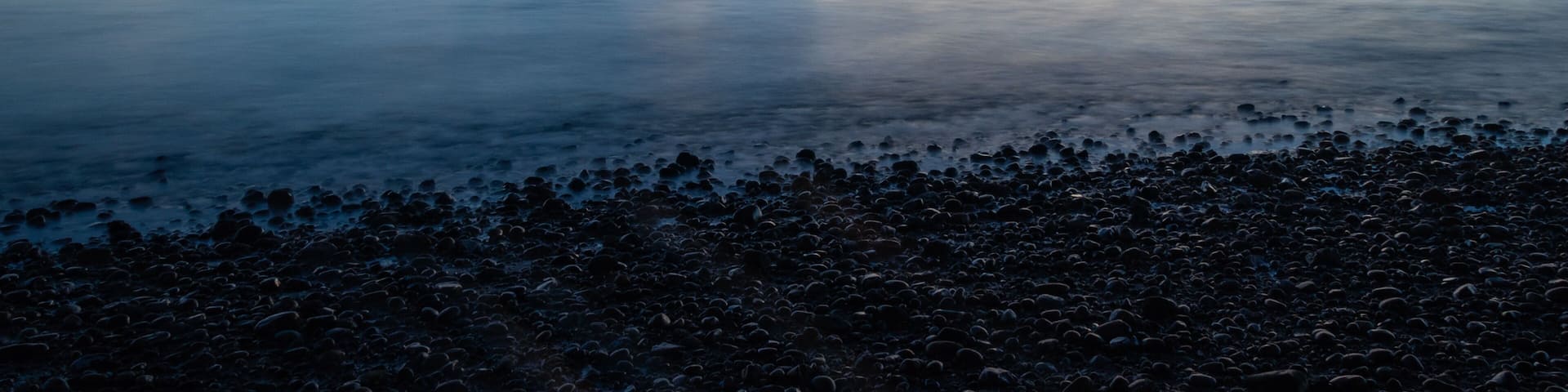 Evening Olympic National park mountain silhouette, sea and clouds in Picnic Point area, WA, USA