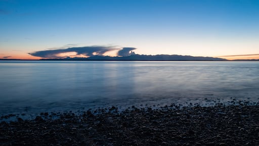Evening Olympic National park mountain silhouette, sea and clouds in Picnic Point area, WA, USA
