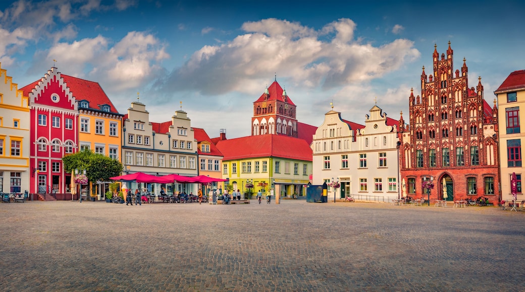 Splendid summer view of colorful building on Marktplatz. Amazing cityscape of Greifswald town with tower of Marienkirche church on background, Germany, Europe. Traveling concept background..