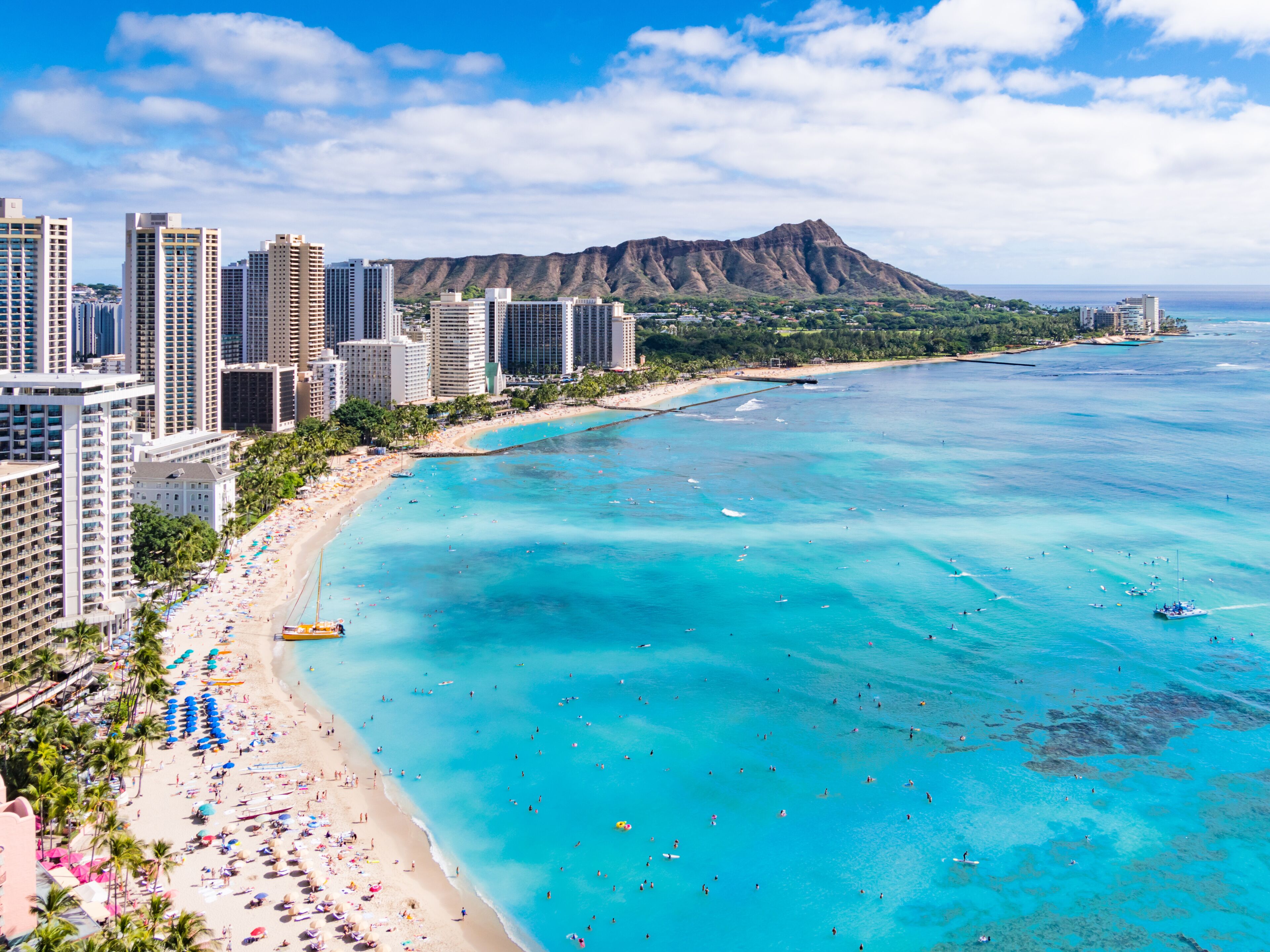 Waikiki Beach and Diamond Head Crater including the hotels and buildings in Waikiki, Honolulu, Oahu island, Hawaii. Waikiki Beach in the center of Honolulu has the largest number of visitors in Hawaii