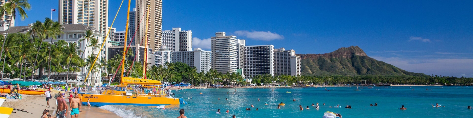 Waikiki Beach featuring swimming, a sandy beach and a city