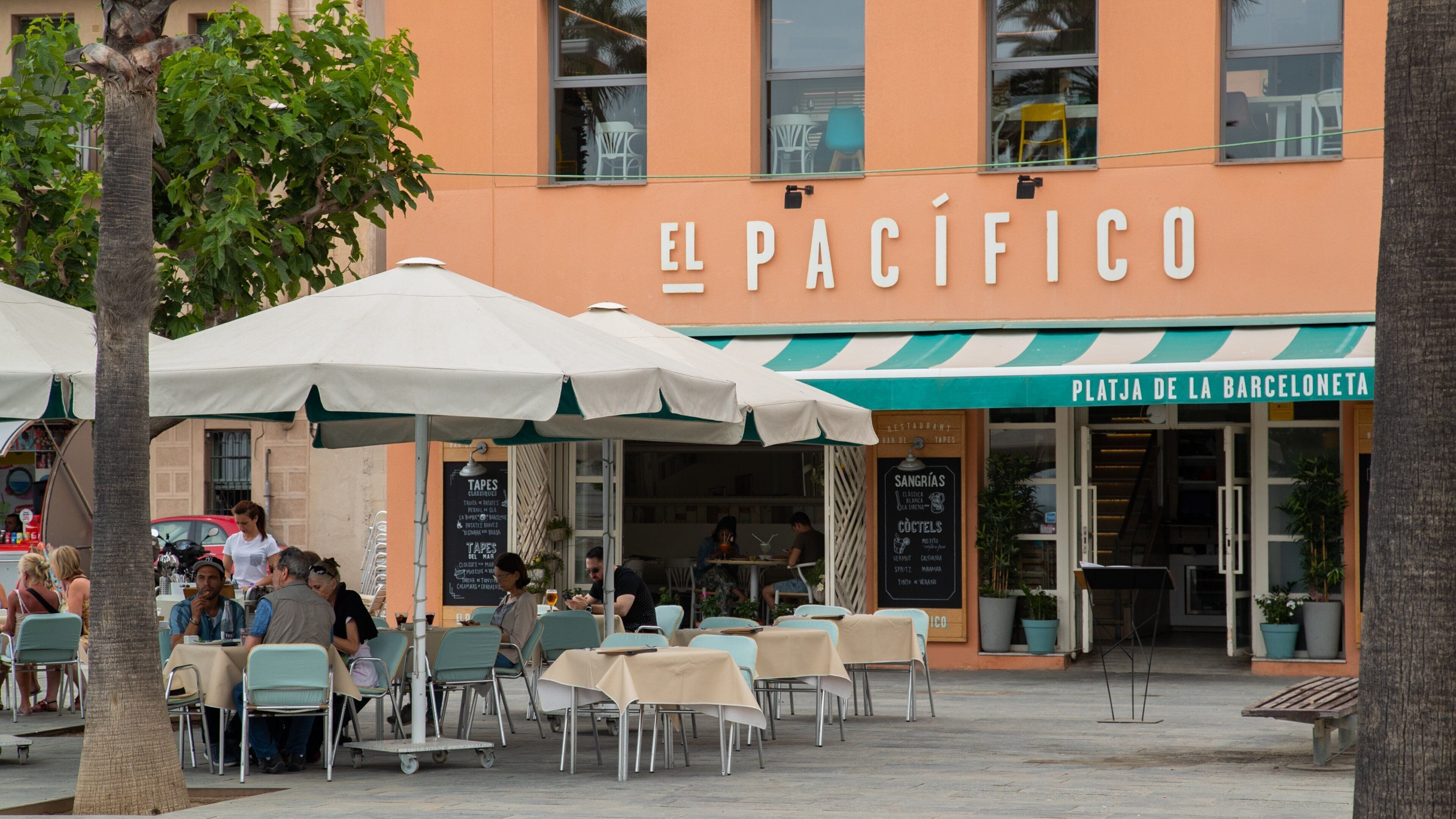 Outdoor seating at El Pacifico restaurant with umbrellas and tables.