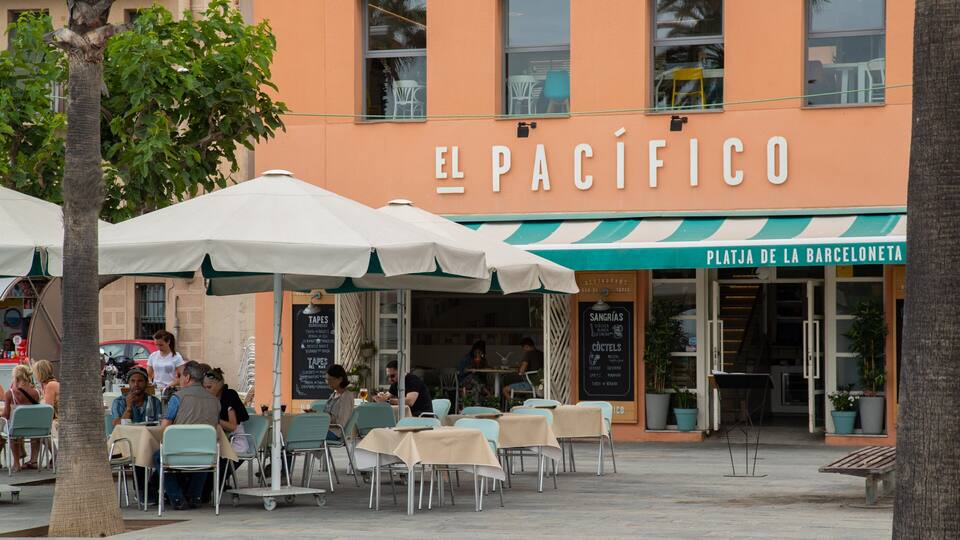 Outdoor seating at El Pacifico restaurant with umbrellas and tables.