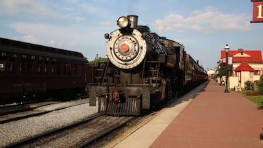 A smoke steam locomotive operated by the Strasburg Rail Road stops and awaits departure at the train station in Strasburg, Lancaster County, Pennsylvania.