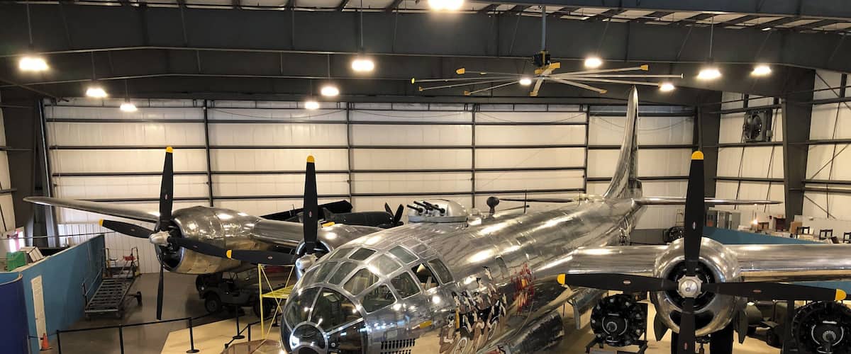 A vintage aircraft on display in a hangar.