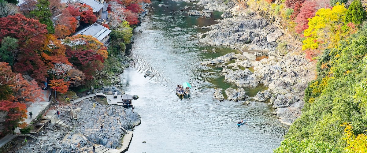 colorful leaves mountains and Katsura river in Arashiyama, landscape landmark and popular for tourists attractions in Kyoto, Japan. Fall Autumn season, Vacation,holiday and Sightseeing concept
