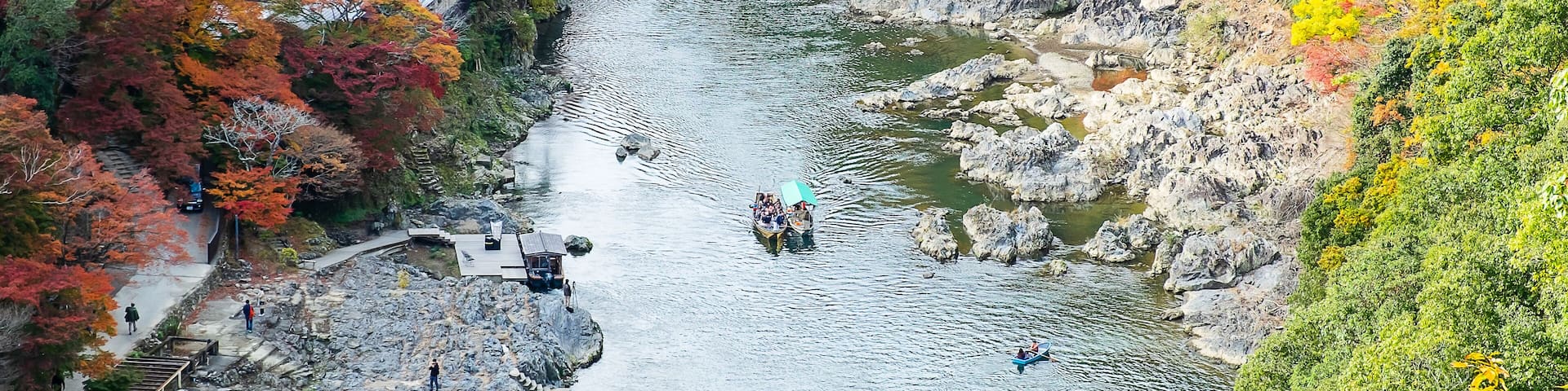 colorful leaves mountains and Katsura river in Arashiyama, landscape landmark and popular for tourists attractions in Kyoto, Japan. Fall Autumn season, Vacation,holiday and Sightseeing concept