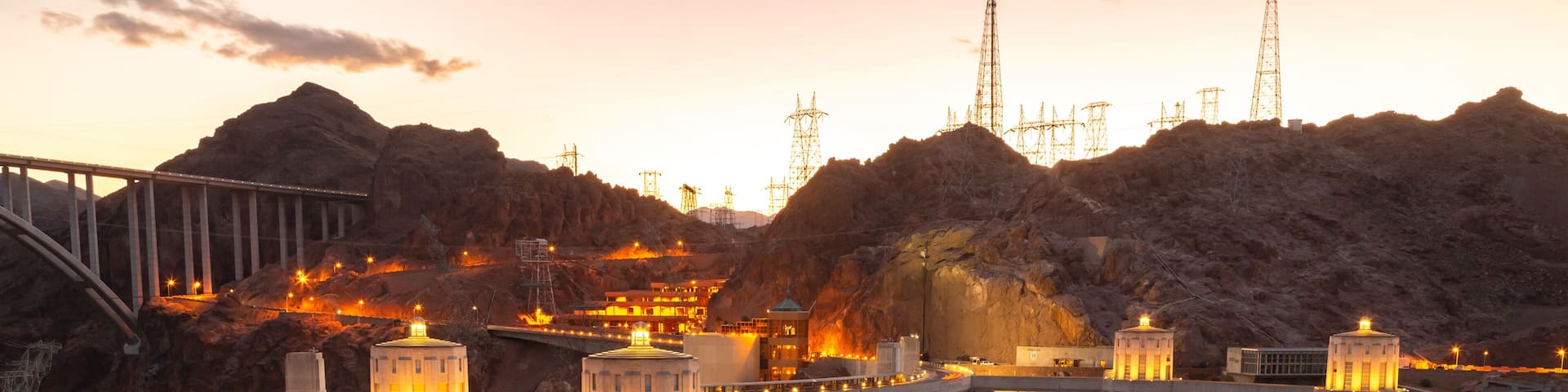 Hoover dam close-up shot. Hoover dam and Lake Mead in Las Vegas area. Large Comstock Intake Towers At Hoover Dam. Hoover Dam in the evening with illuminations without people.