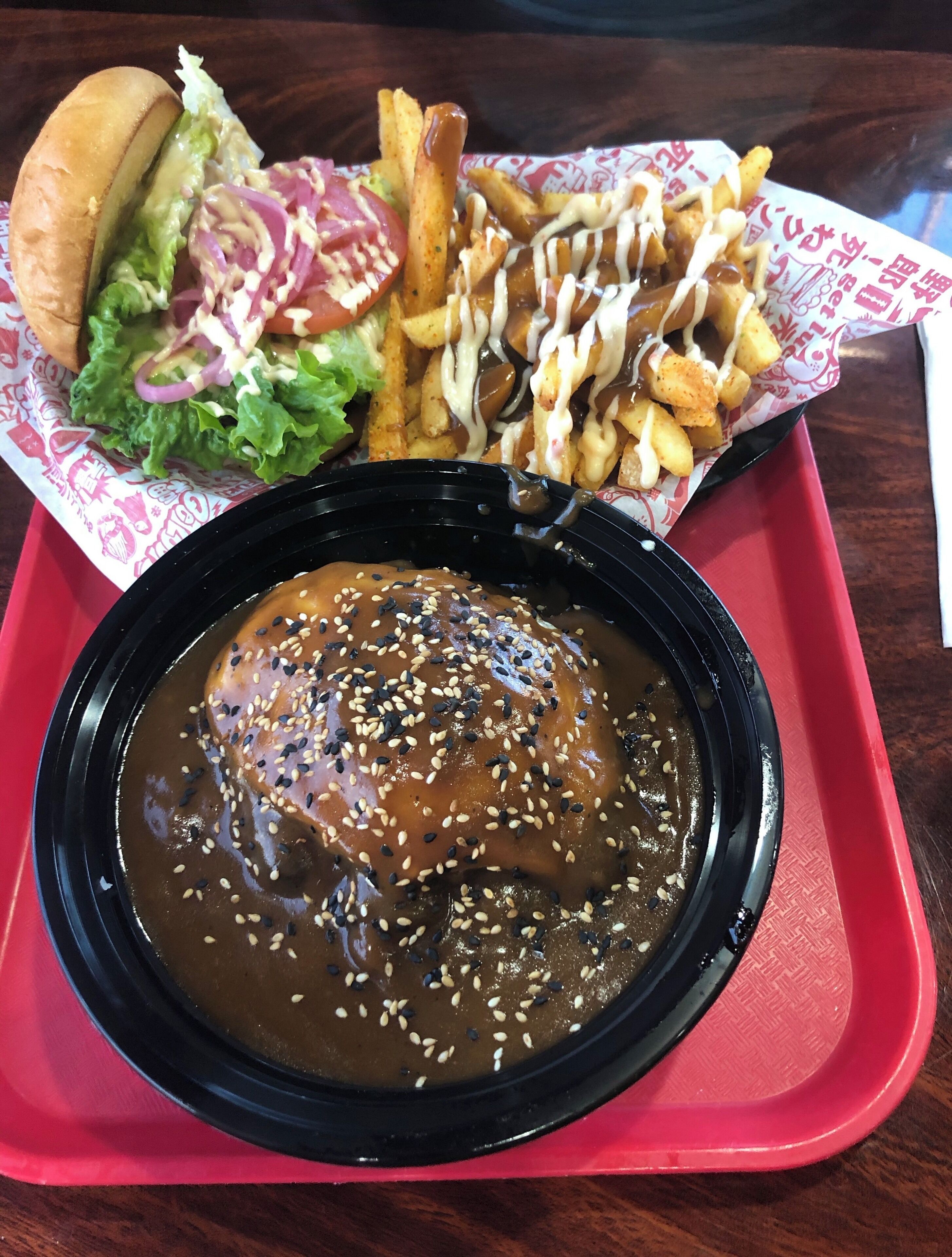 Award winning and amazing burgers with a Japanese twist. The front bowl is a FukuMoco - white rice, burger patty, brown gravy and a fried egg.