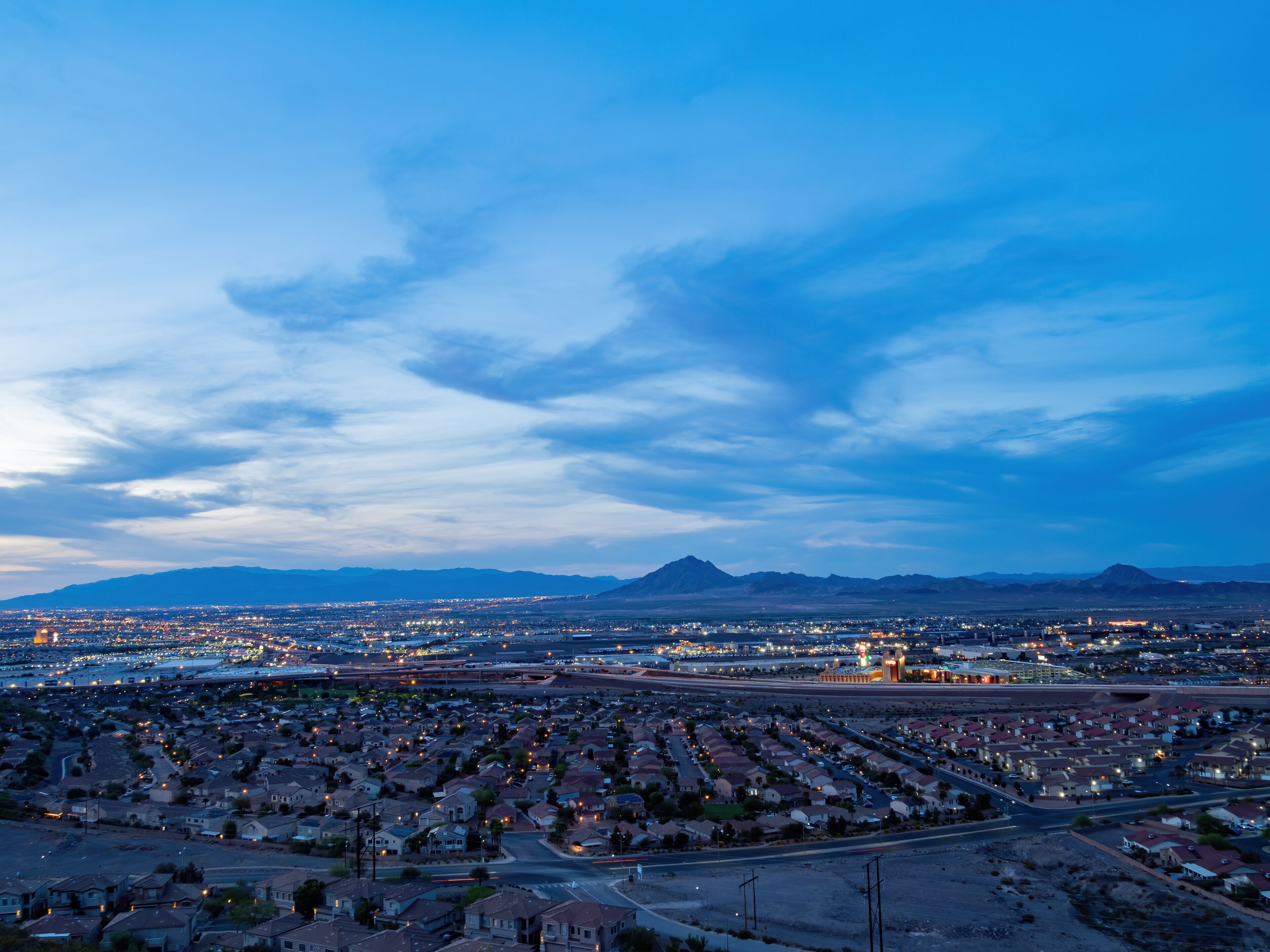 Dusk high angle view of the Frenchman Mountain and cityscape from Henderson View Pass