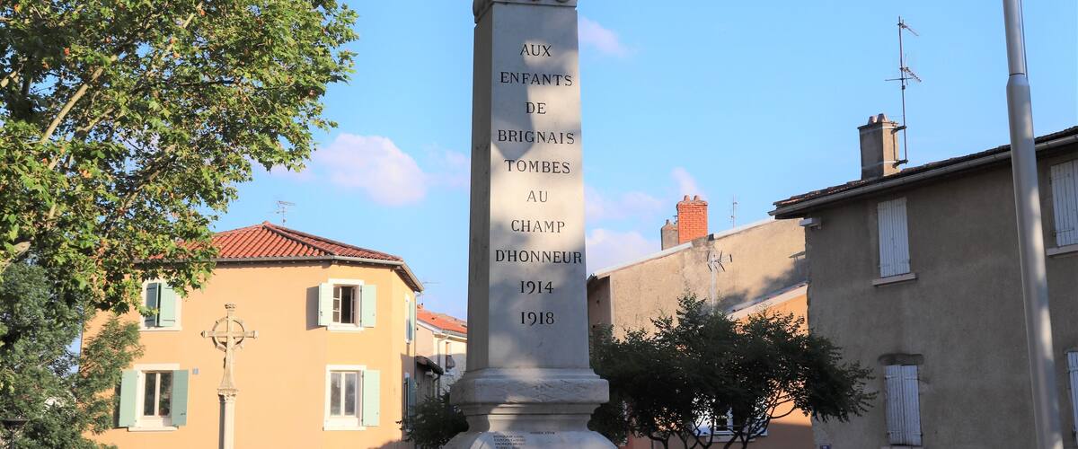 A monument with a bird statue and text commemorating fallen soldiers.