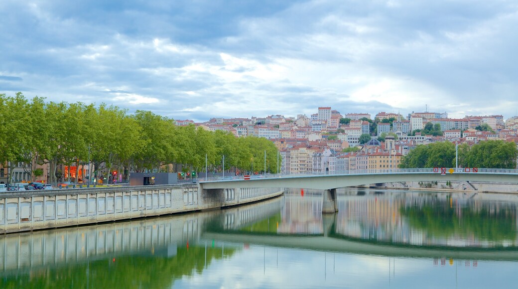 Neuville-sur-Saone showing a city, a bridge and a river or creek